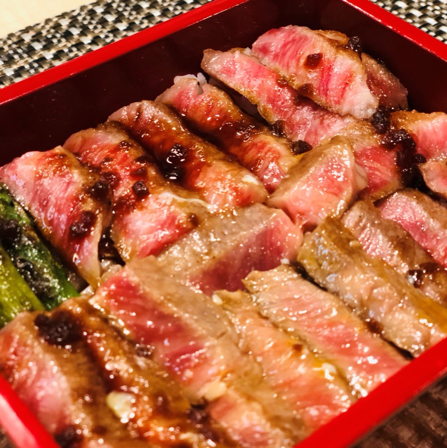 Close-up of seared A5 wagyu slices over rice